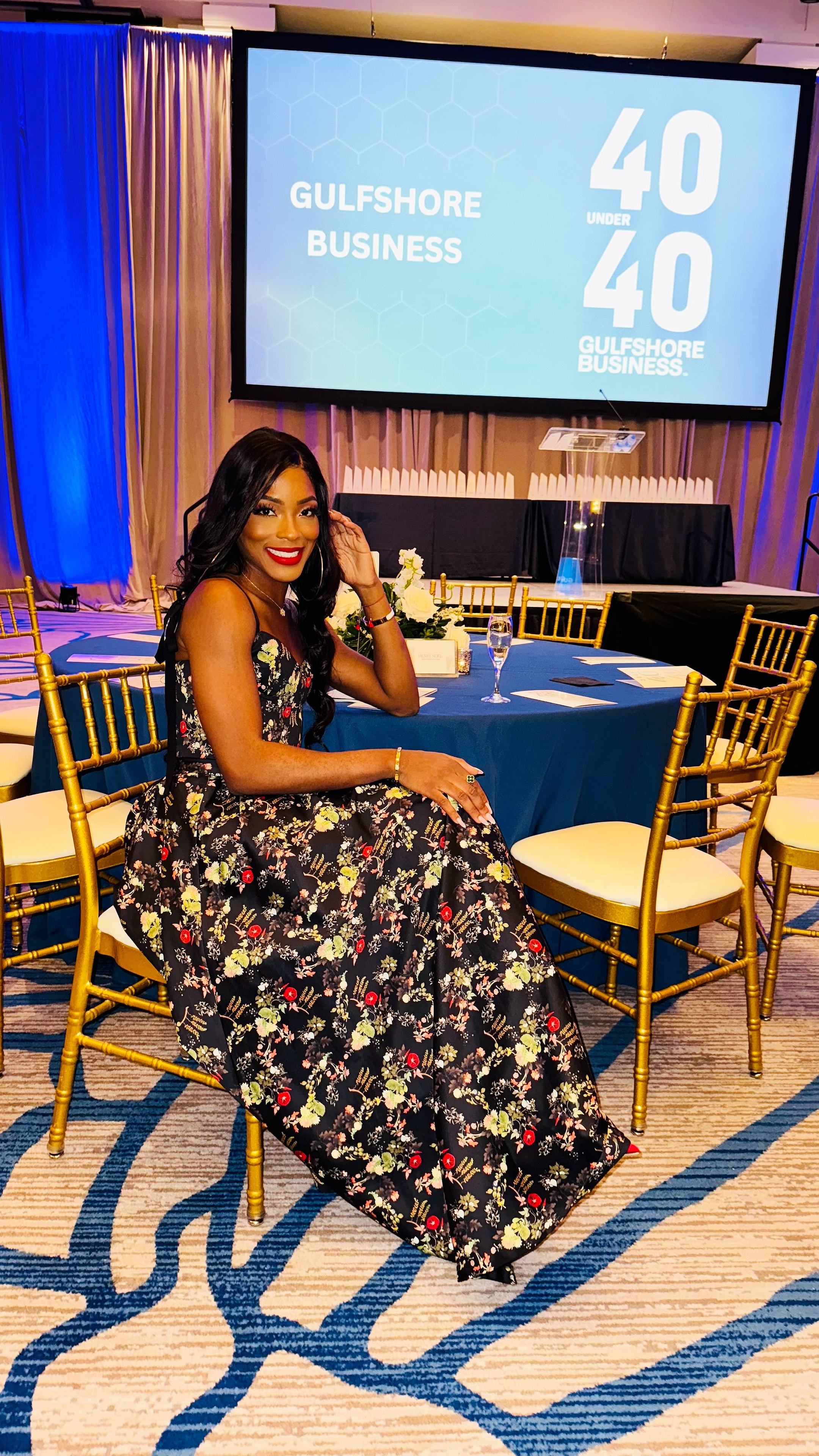 Dr. Deborah Houk at the official Gulfshore Business 40 Under 40 photo backdrop