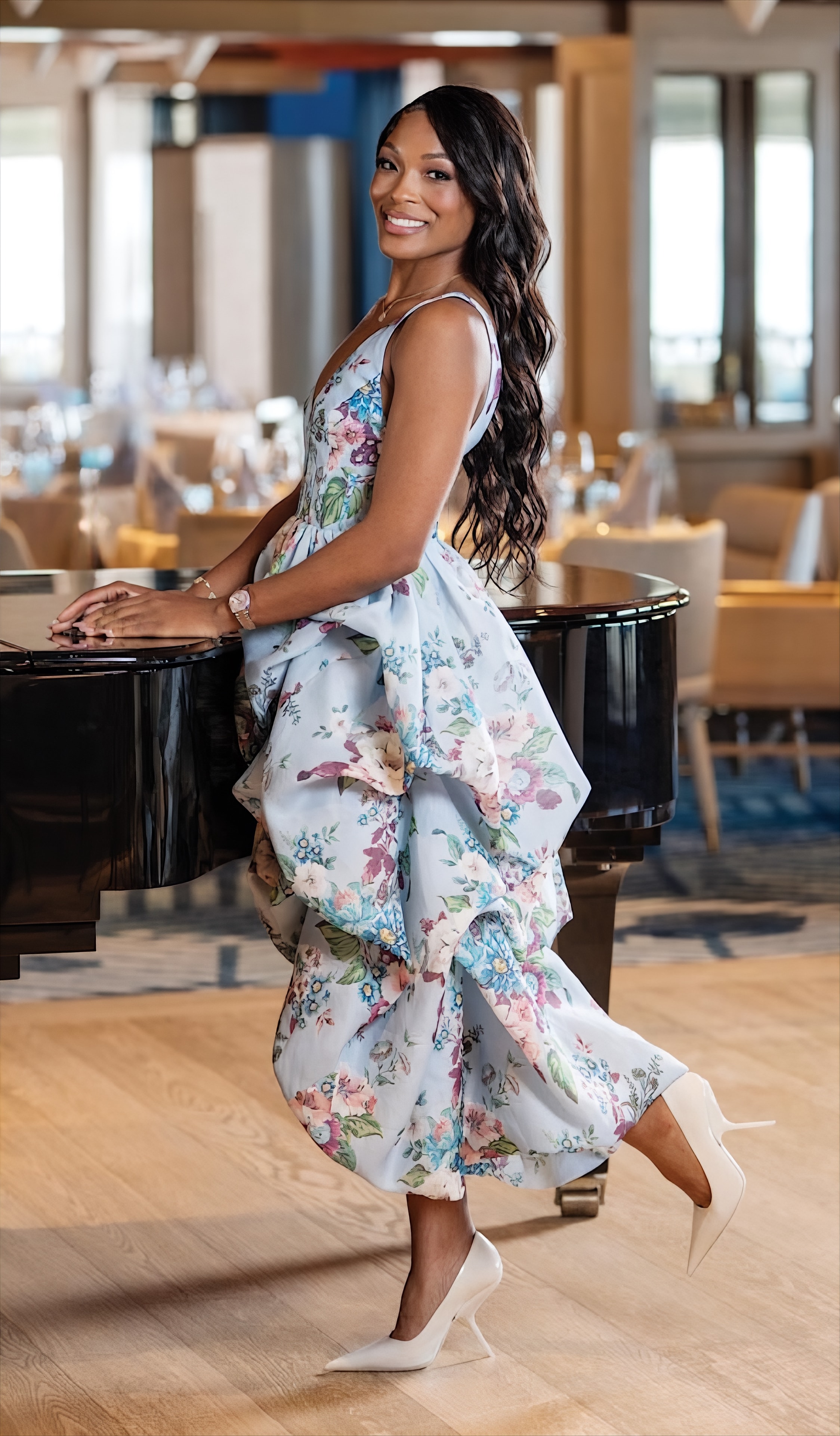 Naples Illustrated — Dr. Deborah Houk at piano bar in blue floral dress